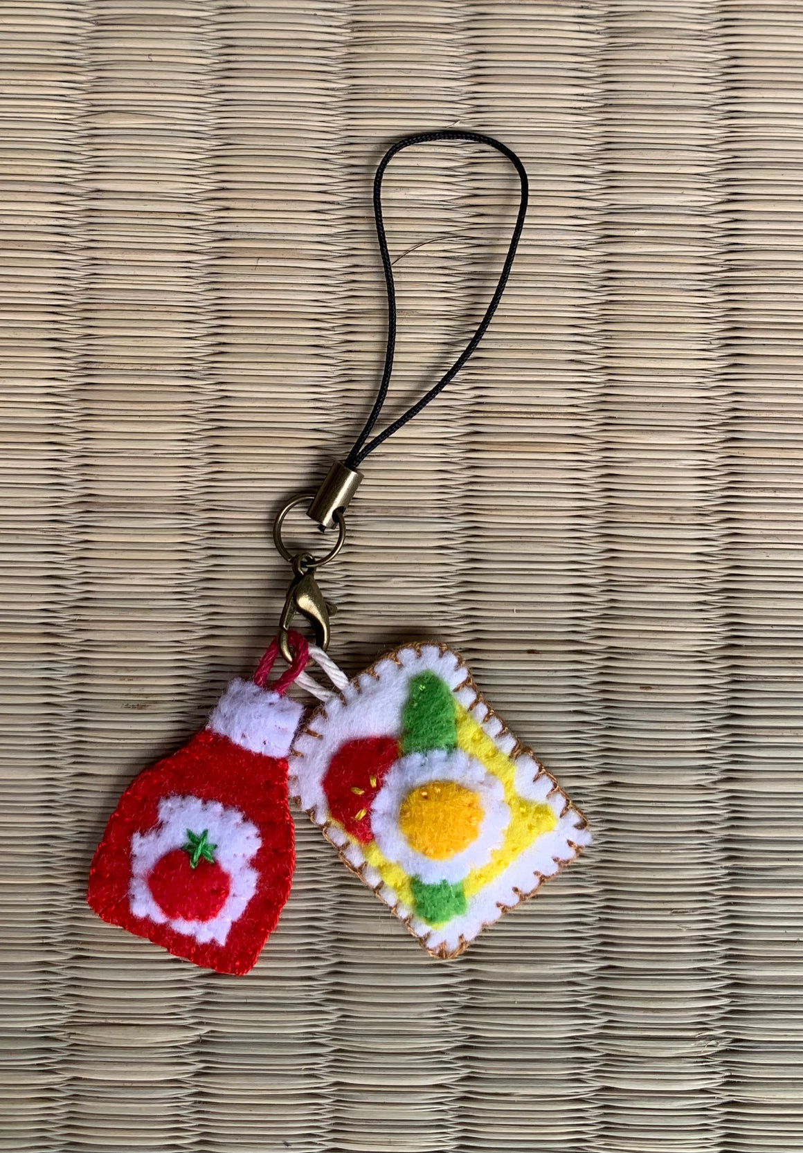 Handmade felt 'eggs on toast' phone strap