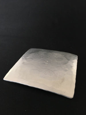 Silvery beaten metal dish handmade in Japan available at Zenbu Home