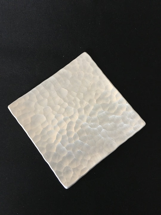 Silvery beaten metal dish handmade in Japan available at Zenbu Home