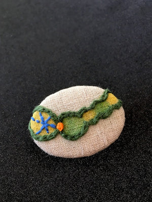 Stitches in Caterpiller brooch designed and handmade in Kyoto Japan