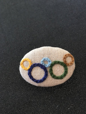 Stitches in rings brooch designed and handmade in Kyoto Japan