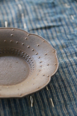 This handsome, hand-crafted iron dish from Japan can be found at Zenbu Home