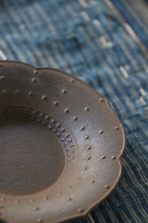 This handsome, hand-crafted iron dish from Japan can be found at Zenbu Home