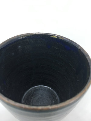 This Japanese black glazed, handmade ceramic tea cup from Zenbu Home is dark and moody.. perfect for a winter's morn 