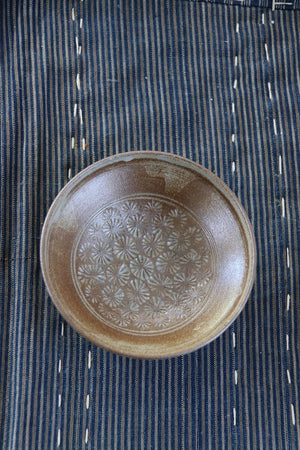 Buy this earthy little ceramic dish decorated in Japanese Chrysanthemum etchings from Zenbu Home 